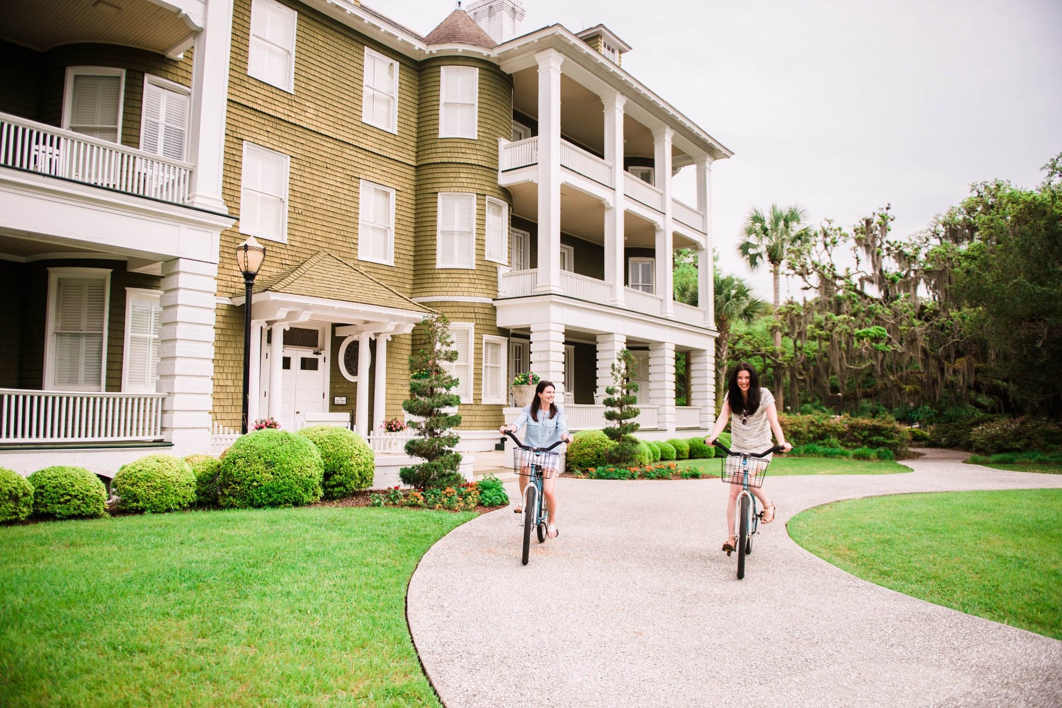 Two kids biking a long a path