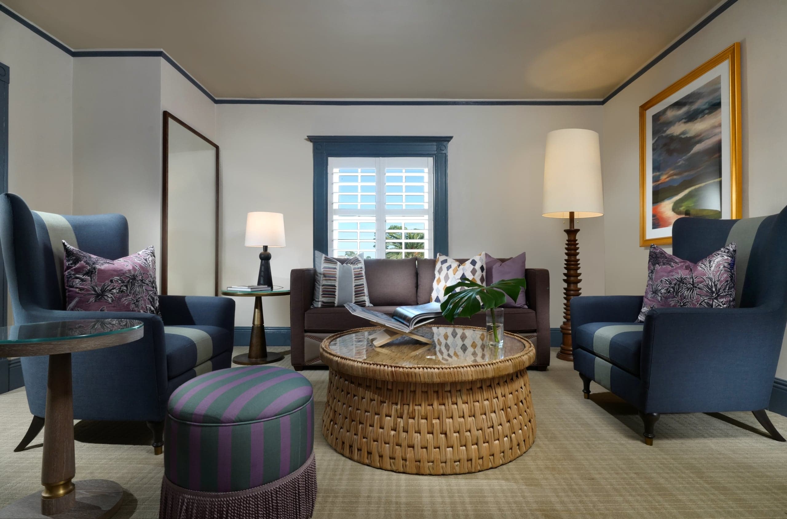A living room in a Clubhouse Deluxe Two Queen Suite