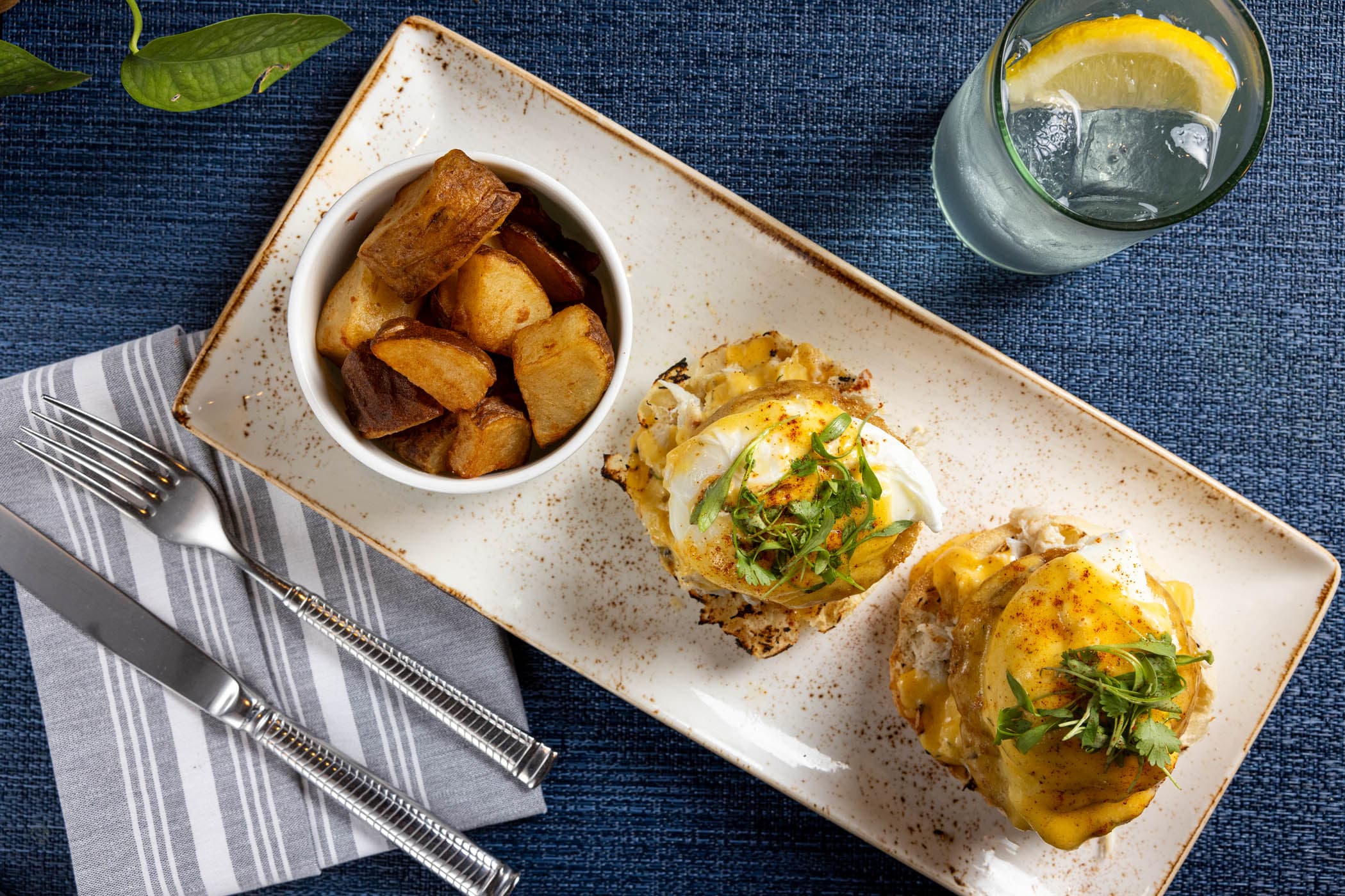 Eggs Benedict and a side of home fries