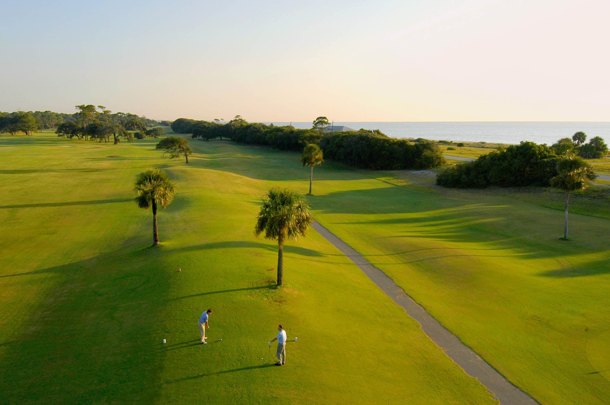 An aerial view on the gold course with someone teeing off