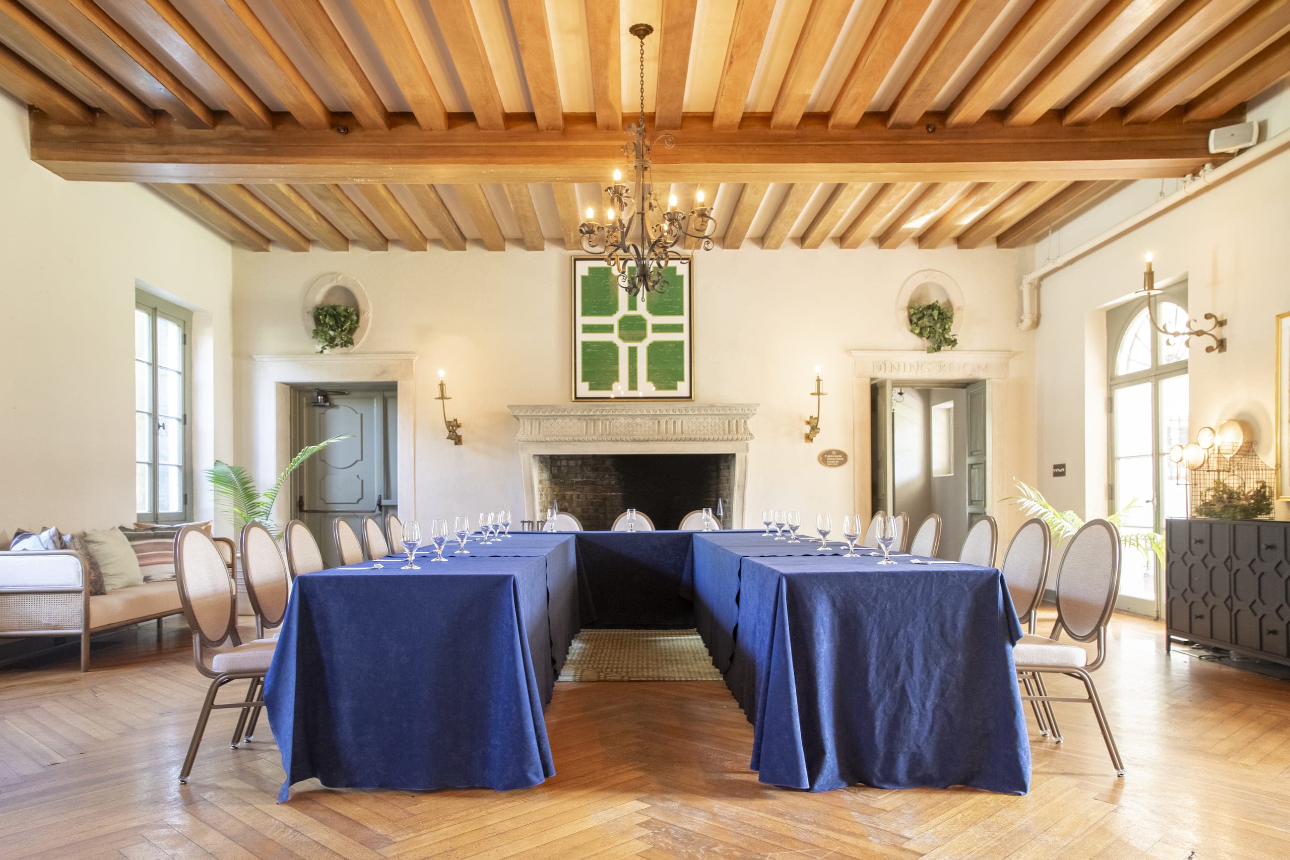 The Crane Living Room set up for a function with a u-shape table arrangement