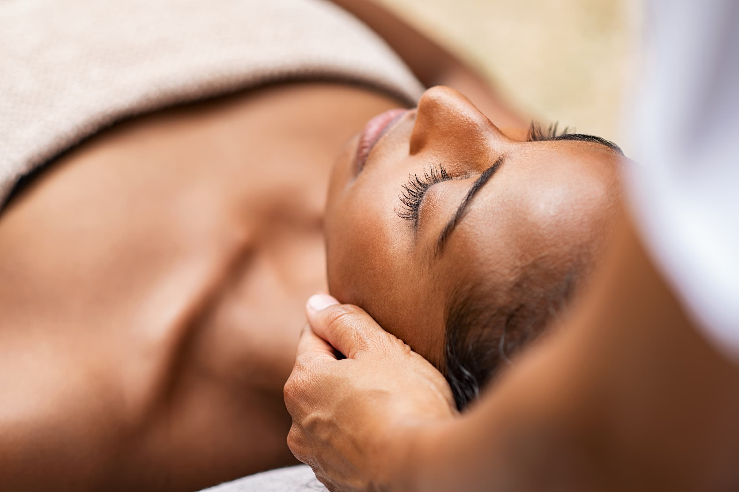 A woman getting a head massage