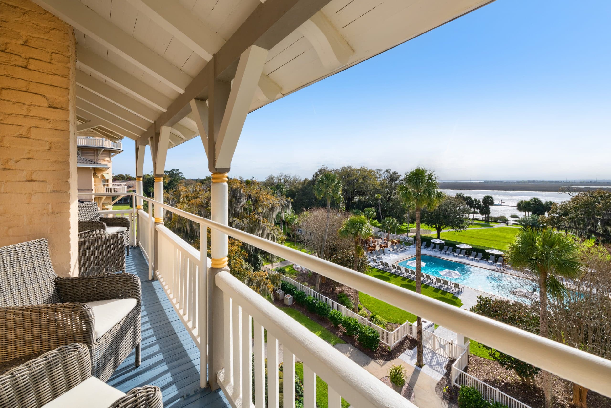 A balcony overlooking the pool and water at JIRC