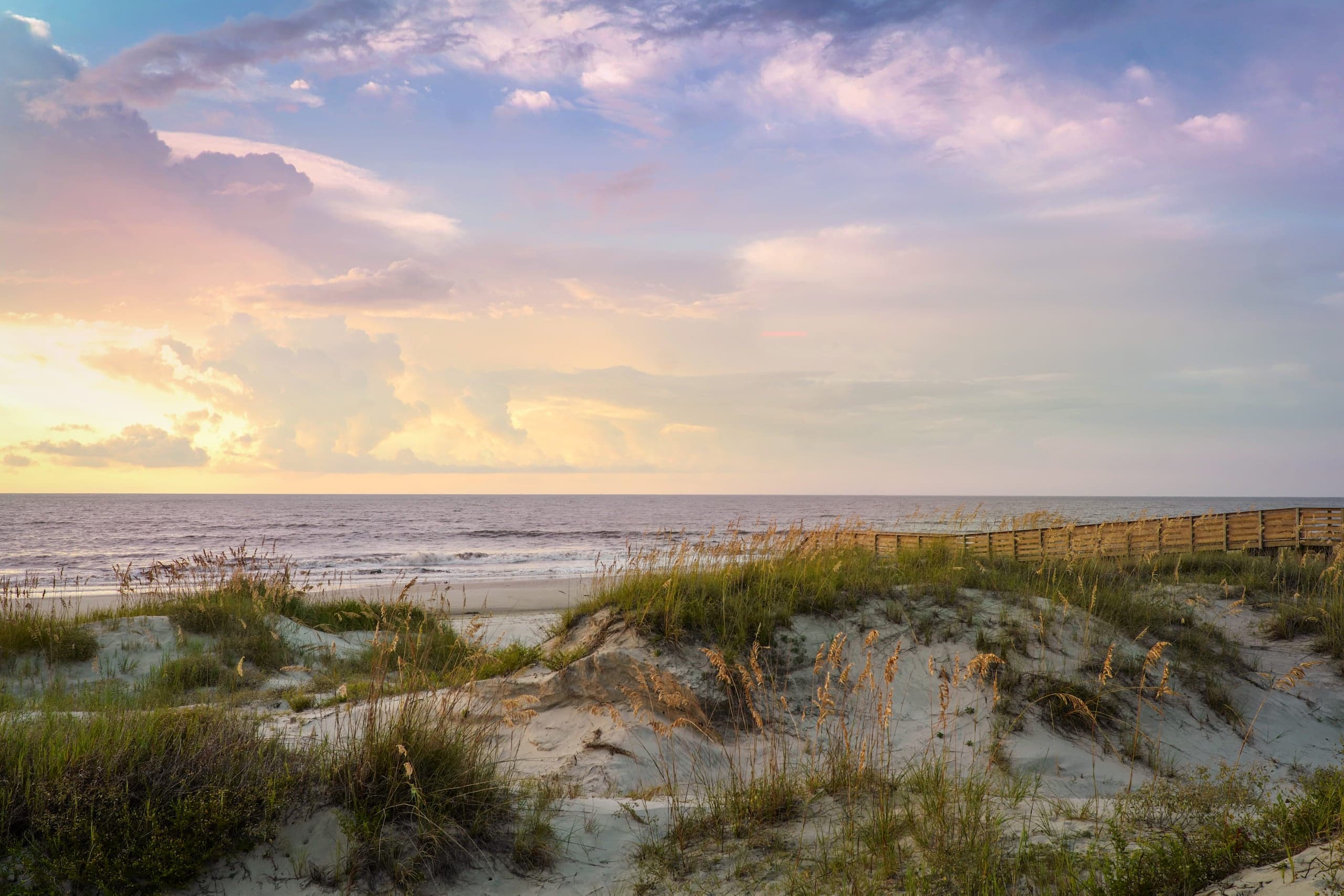 Sand dunes and the beach at the beginning of sunset
