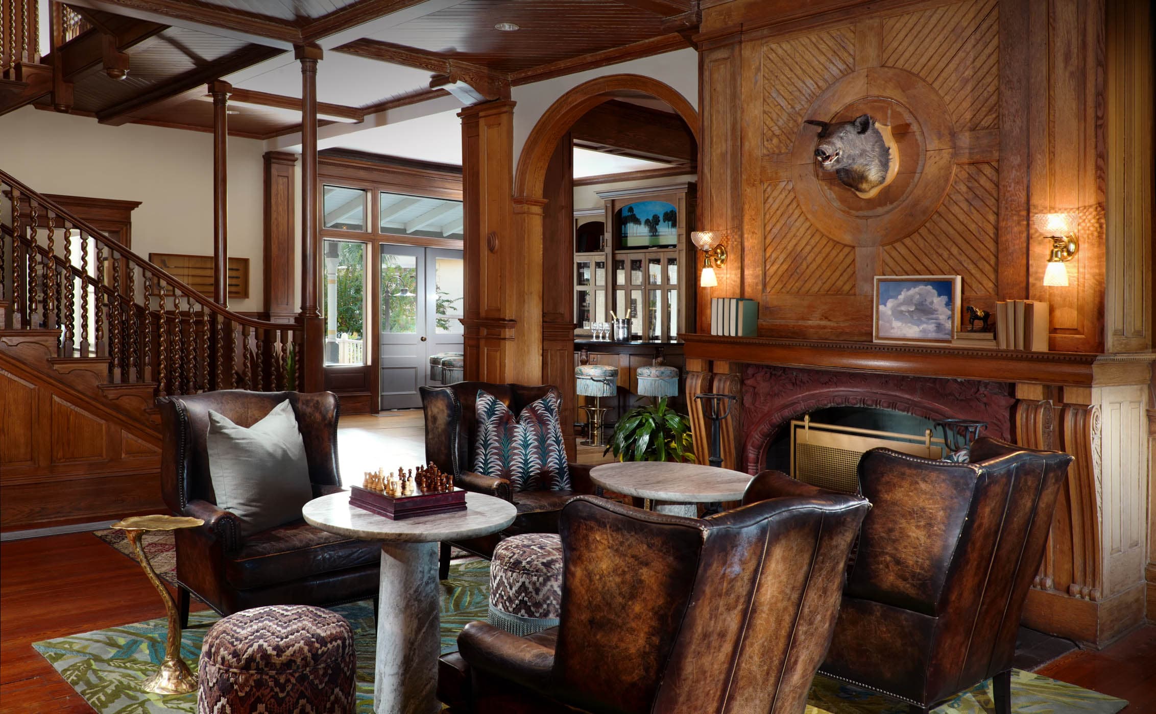 A table beside a gorgeous fireplace at The Alexander Bar