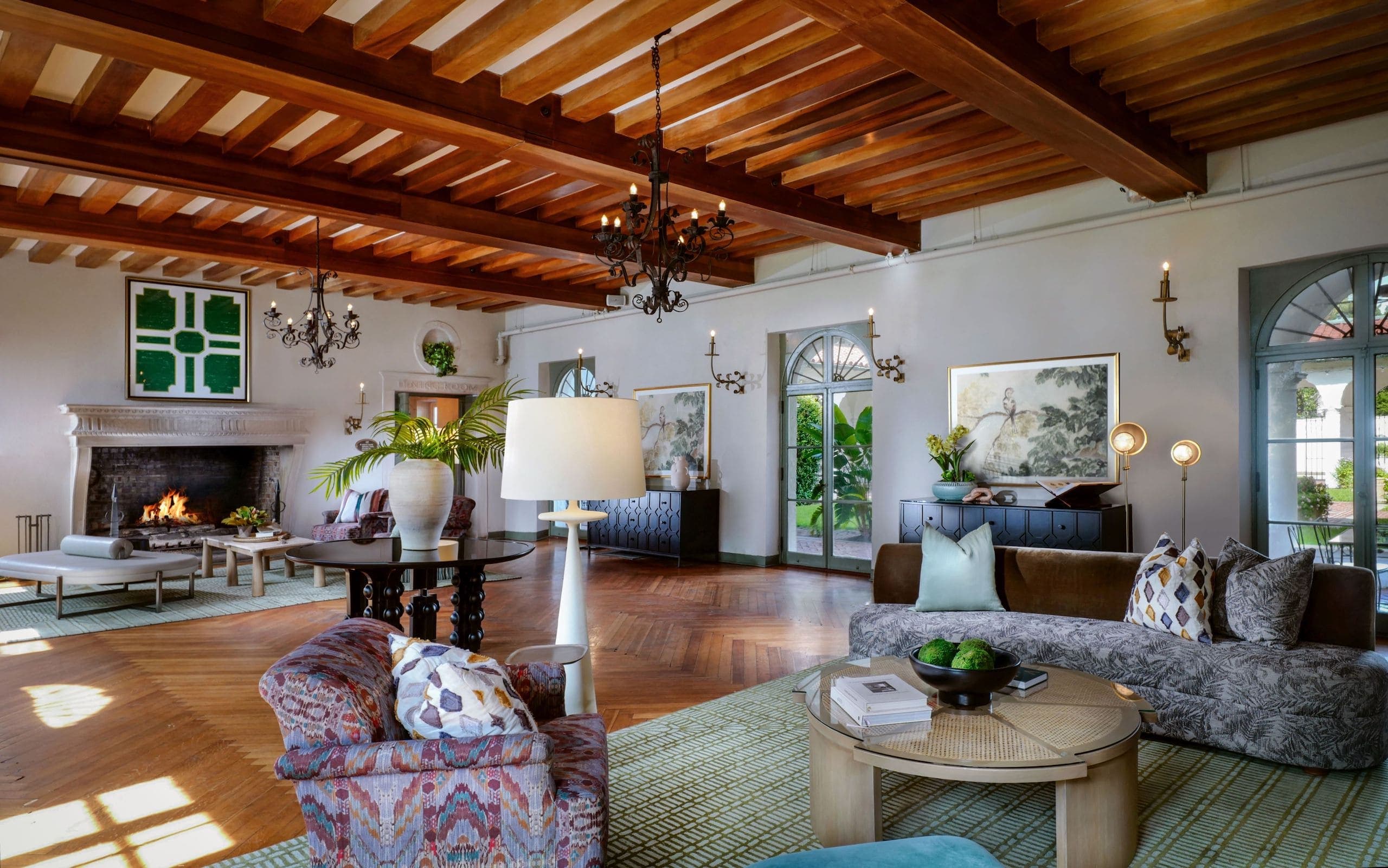 The Crane Living Room with lots of sitting area and a beautiful wood beam ceiling