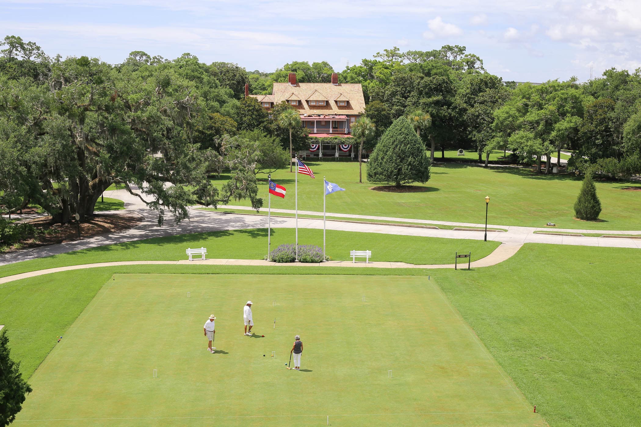 3 people on the practice green