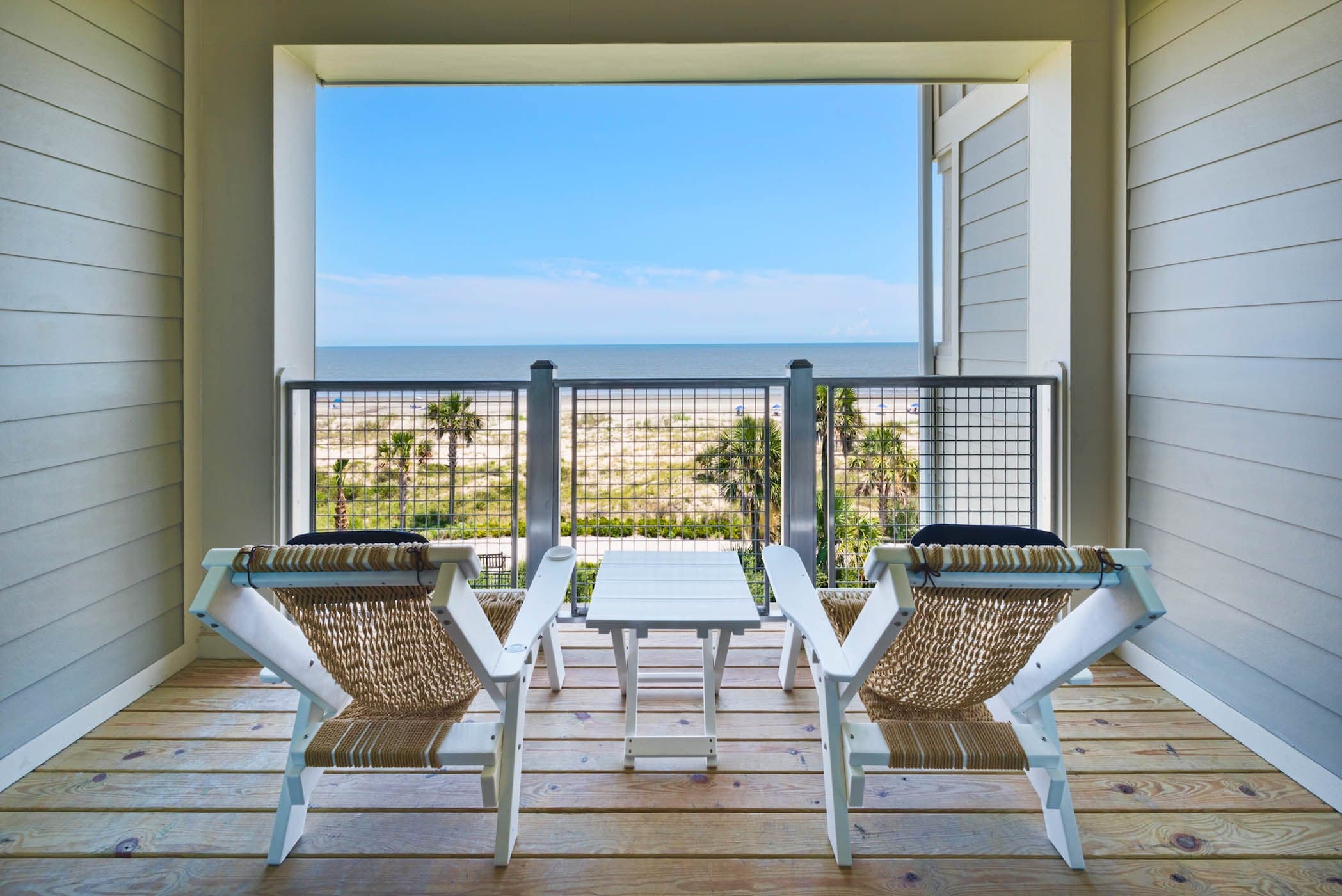 A balcony with 2 chairs at JOC