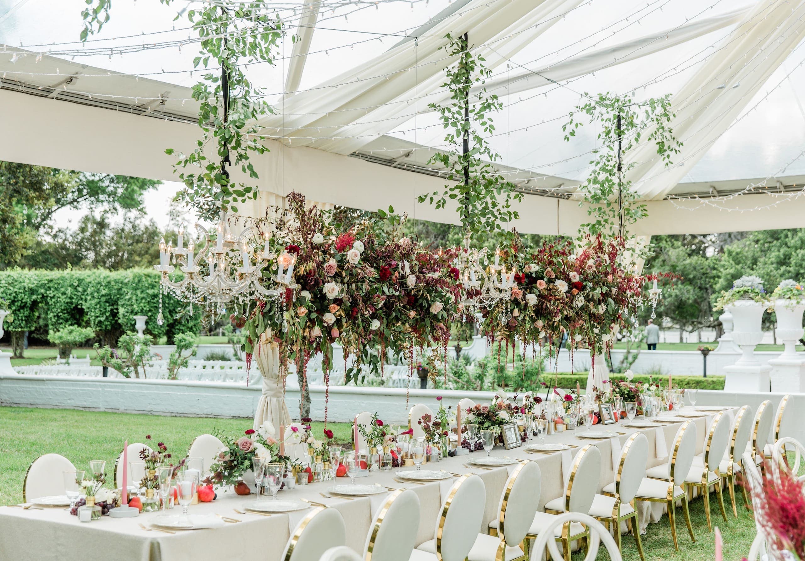 A table set up for a wedding with gorgeous flower arrangements all around