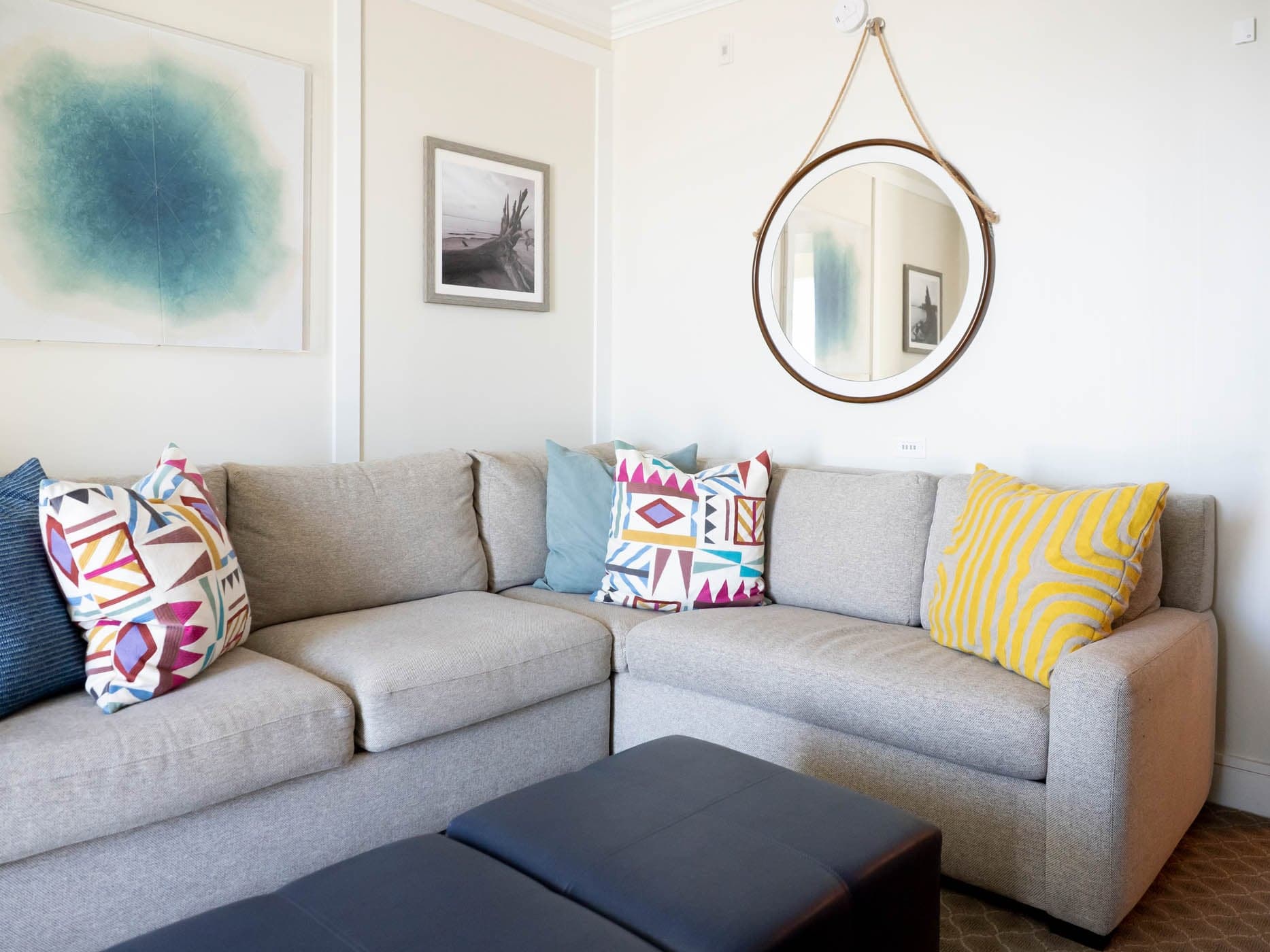 A sectional couch and decorated walls at Jekyll