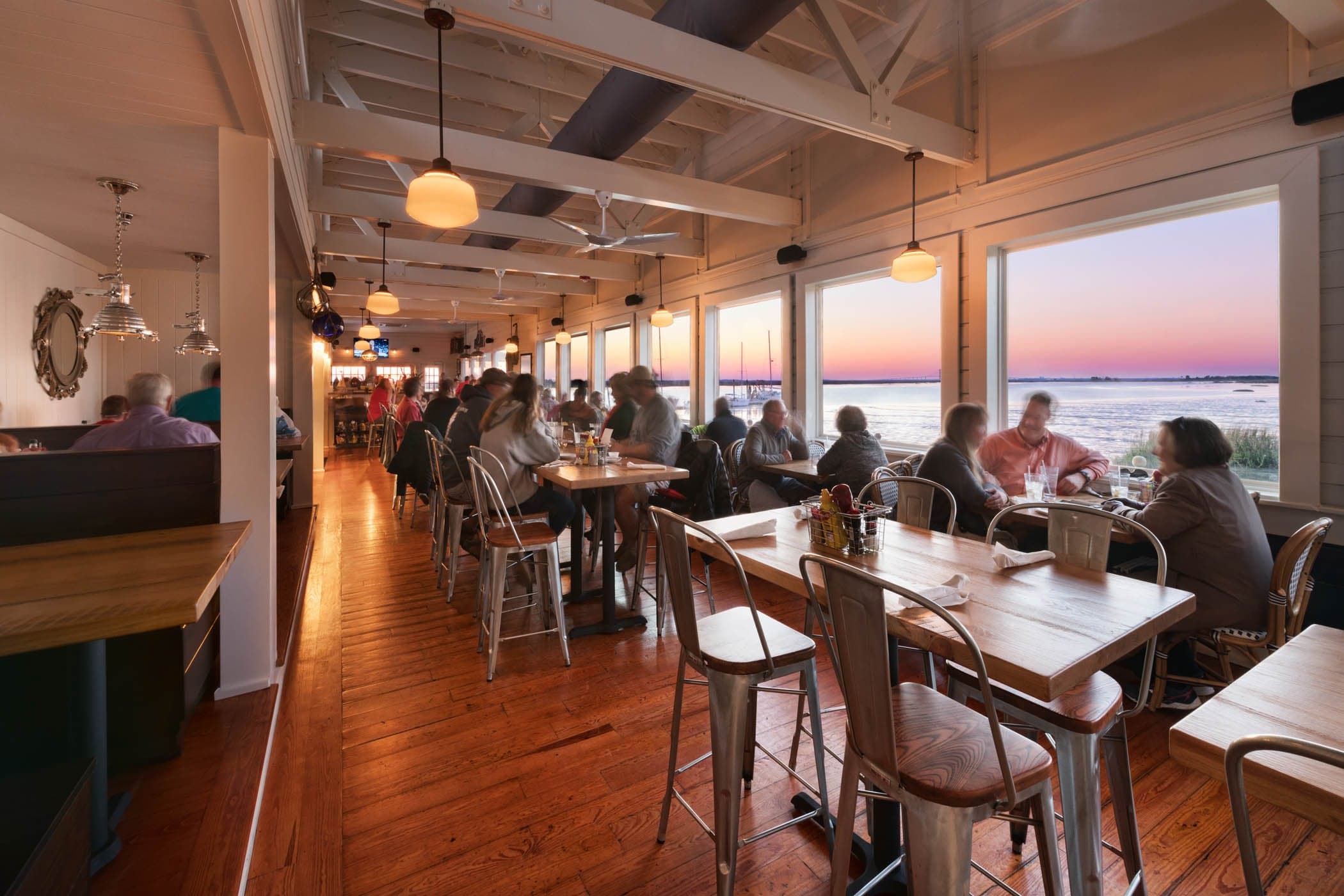 A packed Wharf at sunset