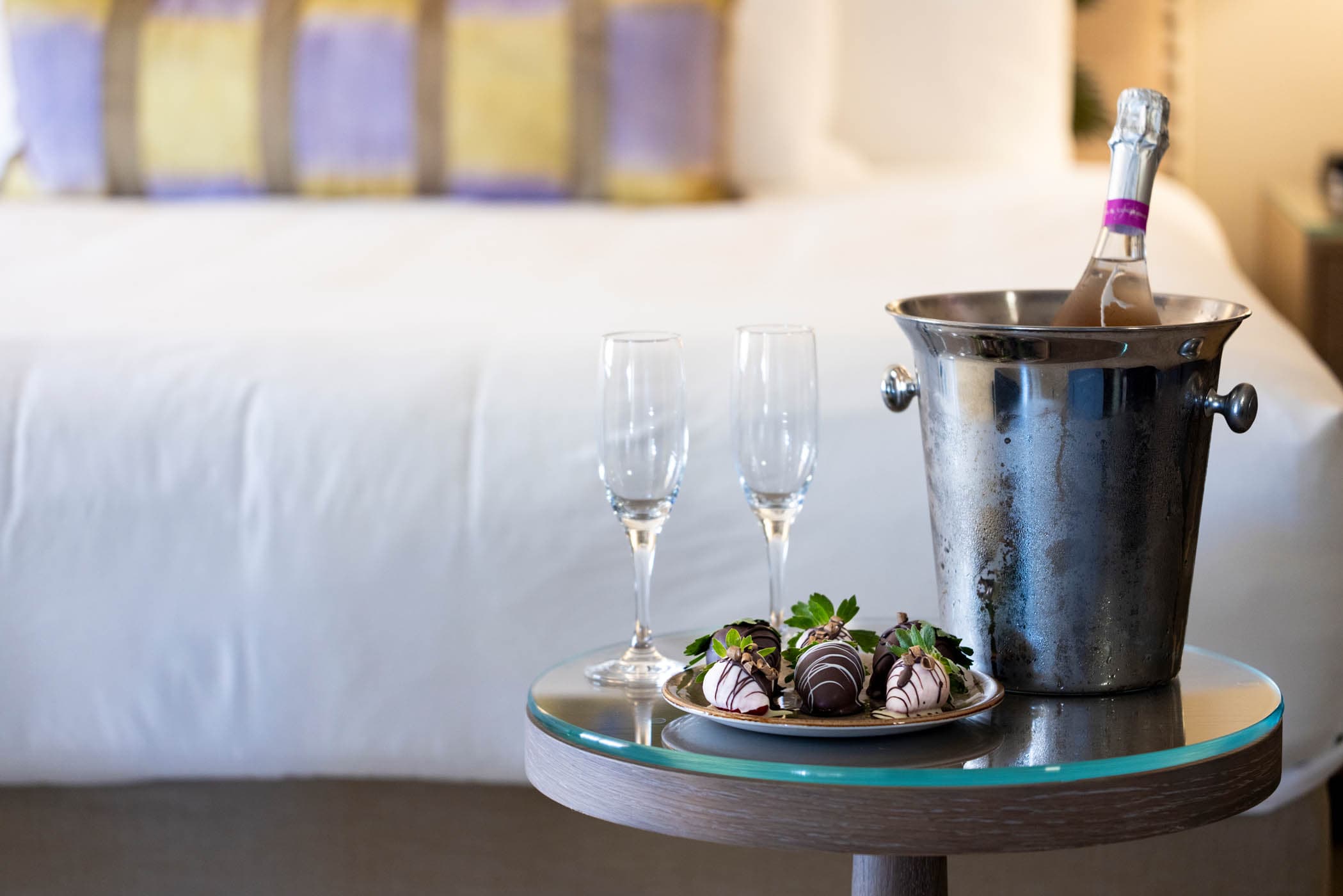 A bucket of sparkling in a room with chocolates