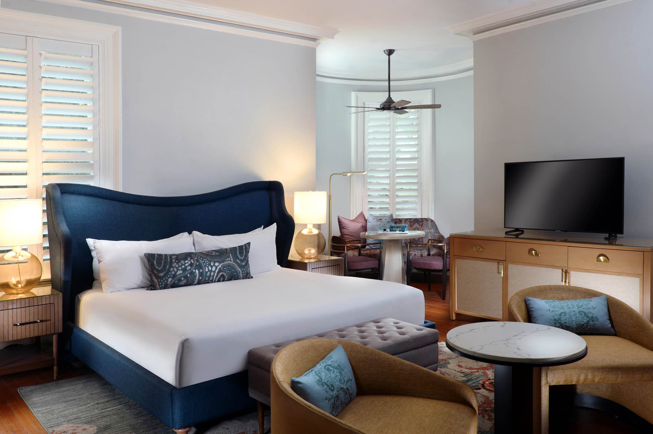 The king bed, Tv and sitting ares in a San Souci Deluxe King room