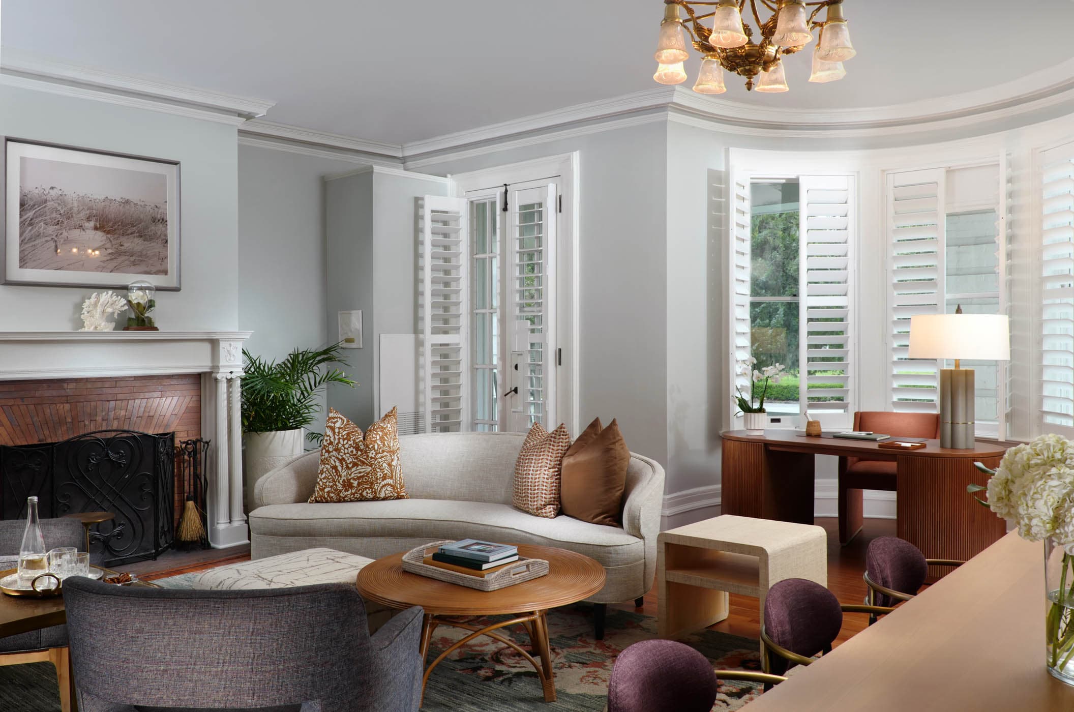 San Souci Governor's Suite Living Room with a fireplace, desk and a lot of seating