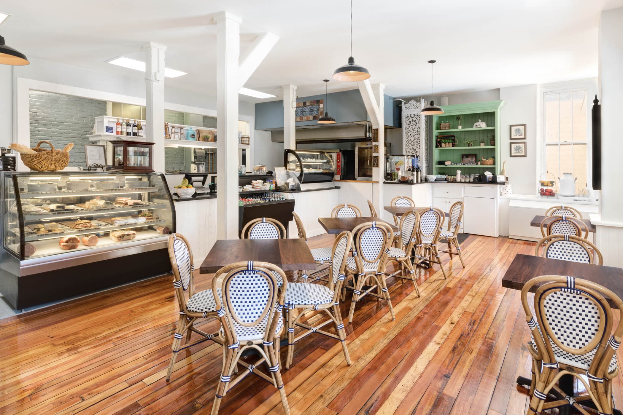 Inside The Pantry with 5 tables and a counter to order