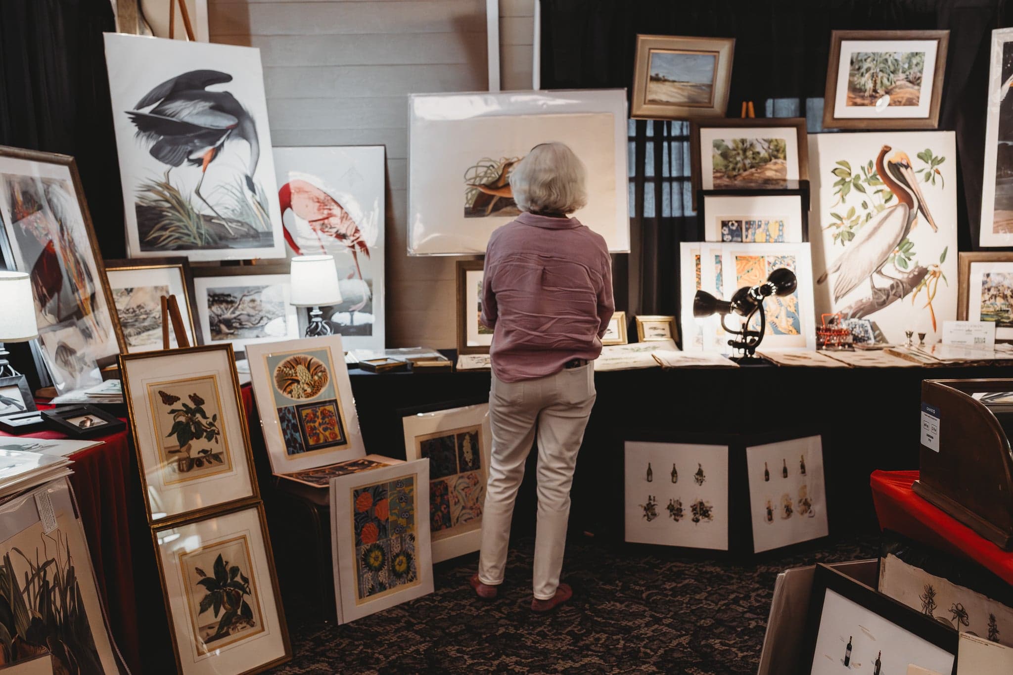 A woman shopping for an art piece