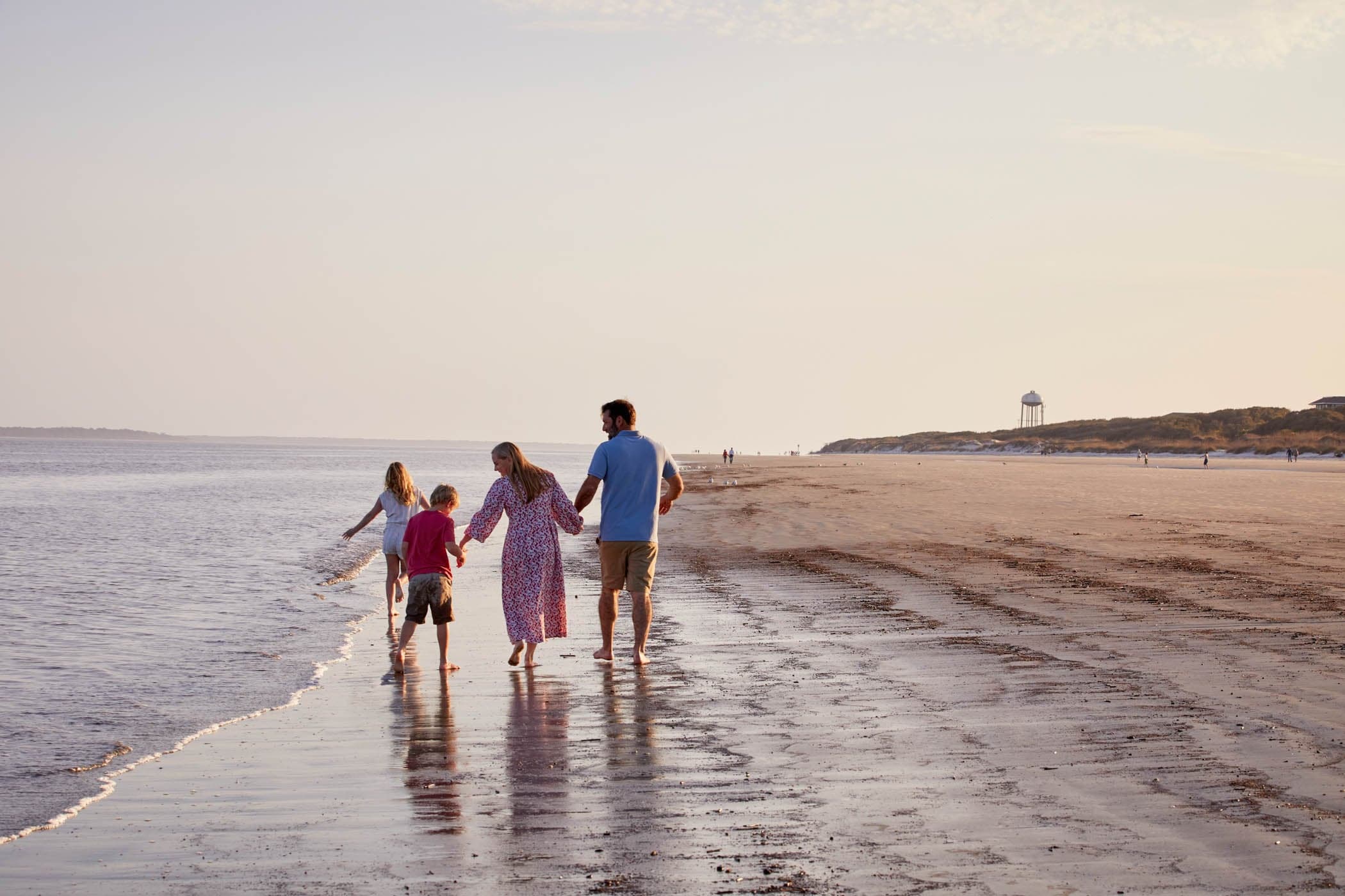 A family walking a long the beach