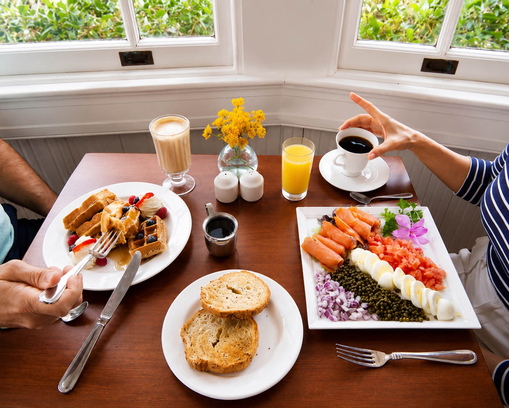 Waffles, lox, and beverages in a room at Jekyll
