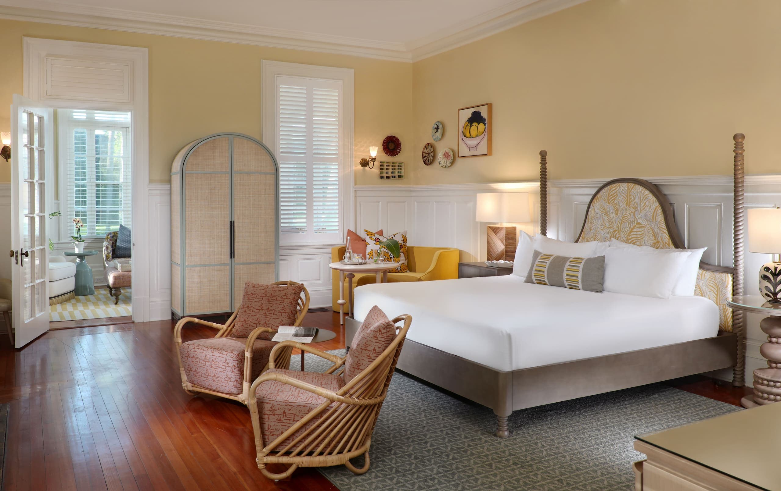 The bed, living space and sun room in a Cherokee Deluxe King Suite