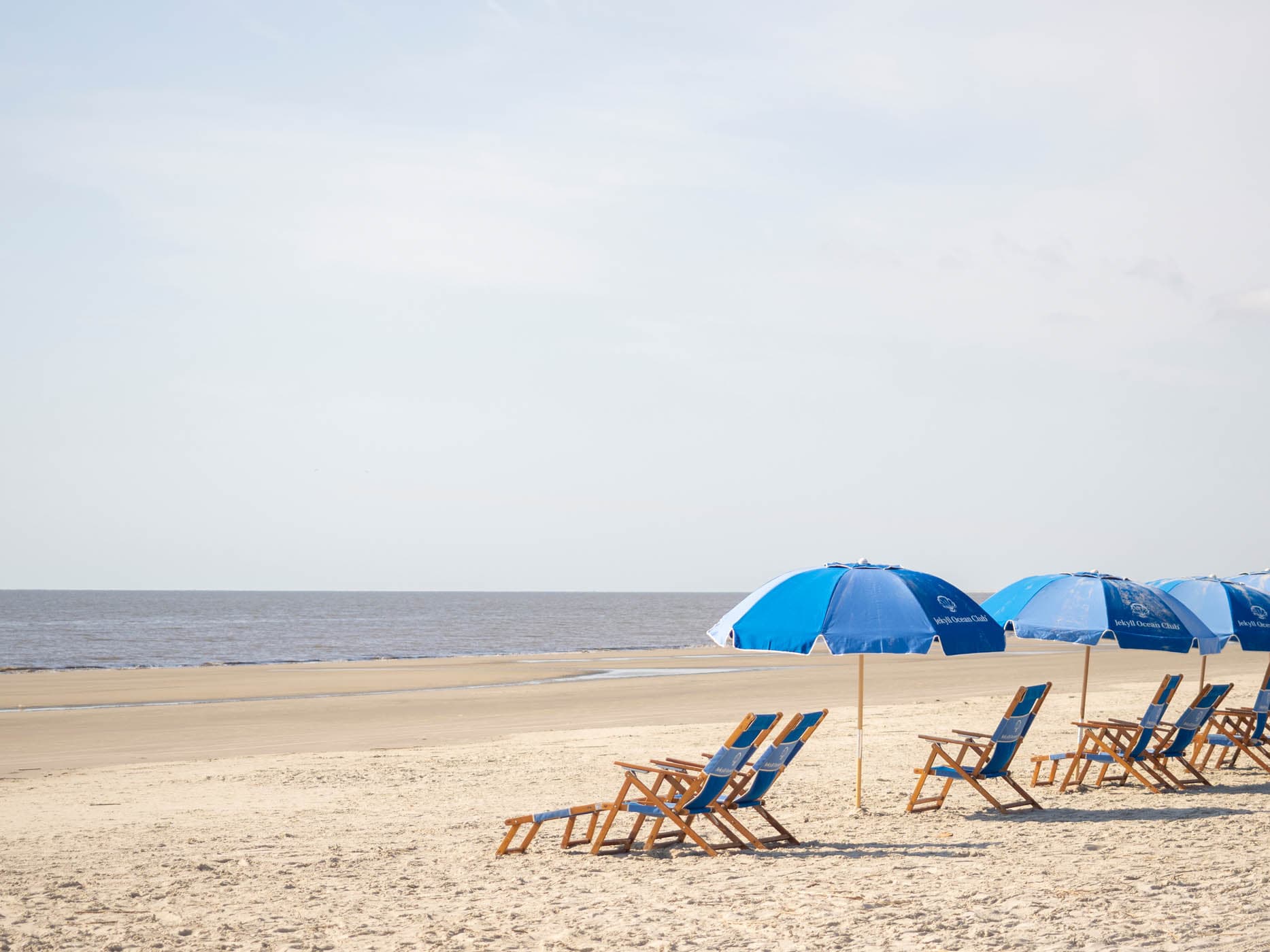 Beach chairs and umbrellas set up on Jekyll Ocean Club Beach
