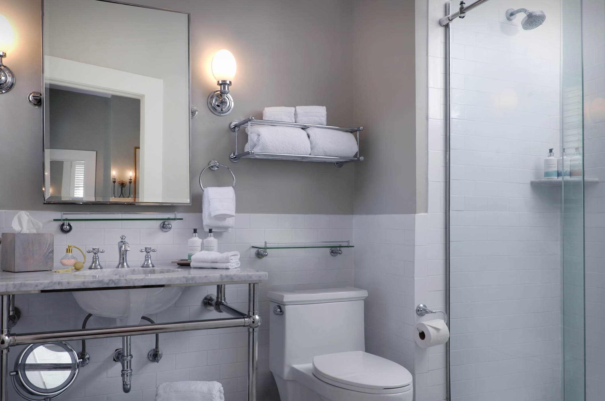 A bathroom at Jekyll with a vanity, shower and plenty of towels