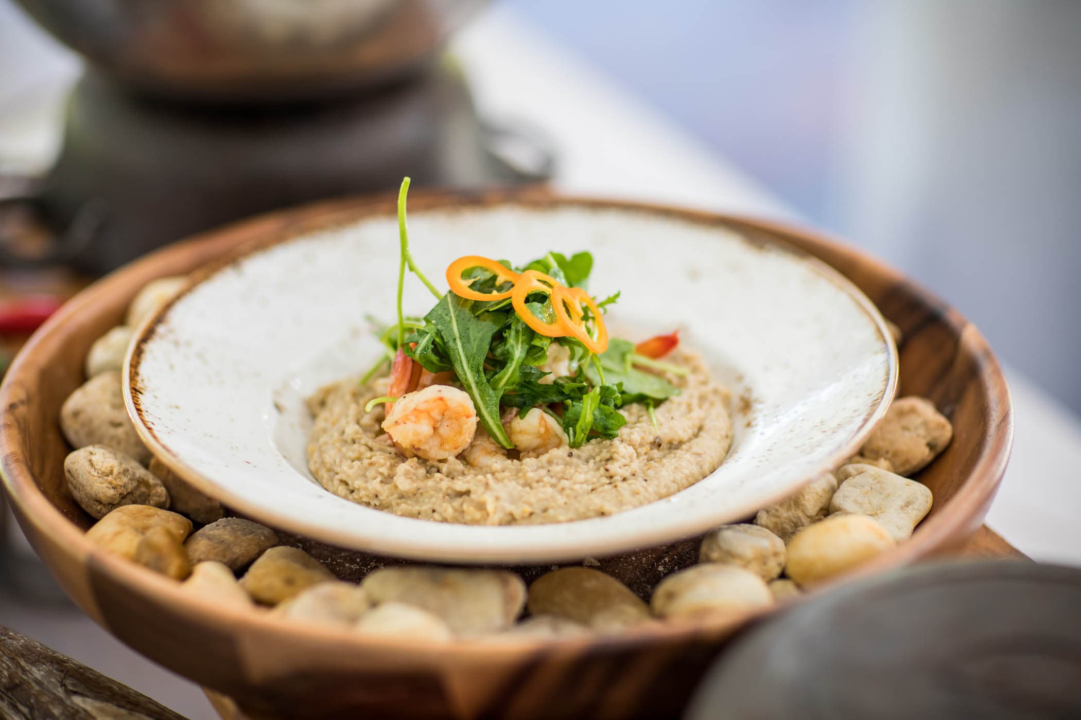 Shrimp and Grits with arugula and pepper slices