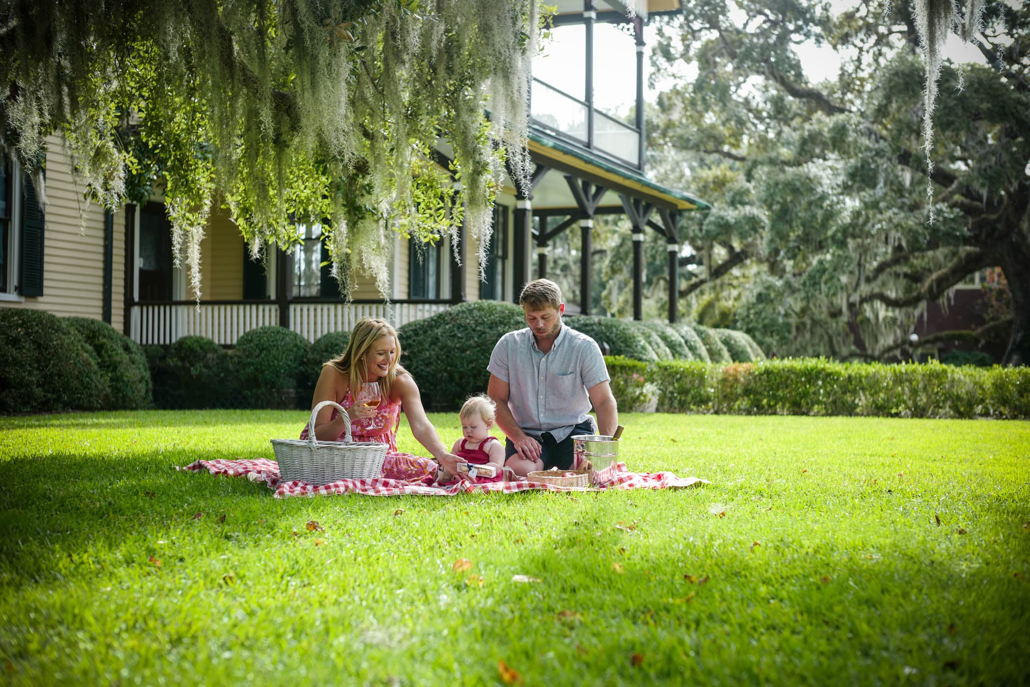A family having a picnic on a lawn near JICR