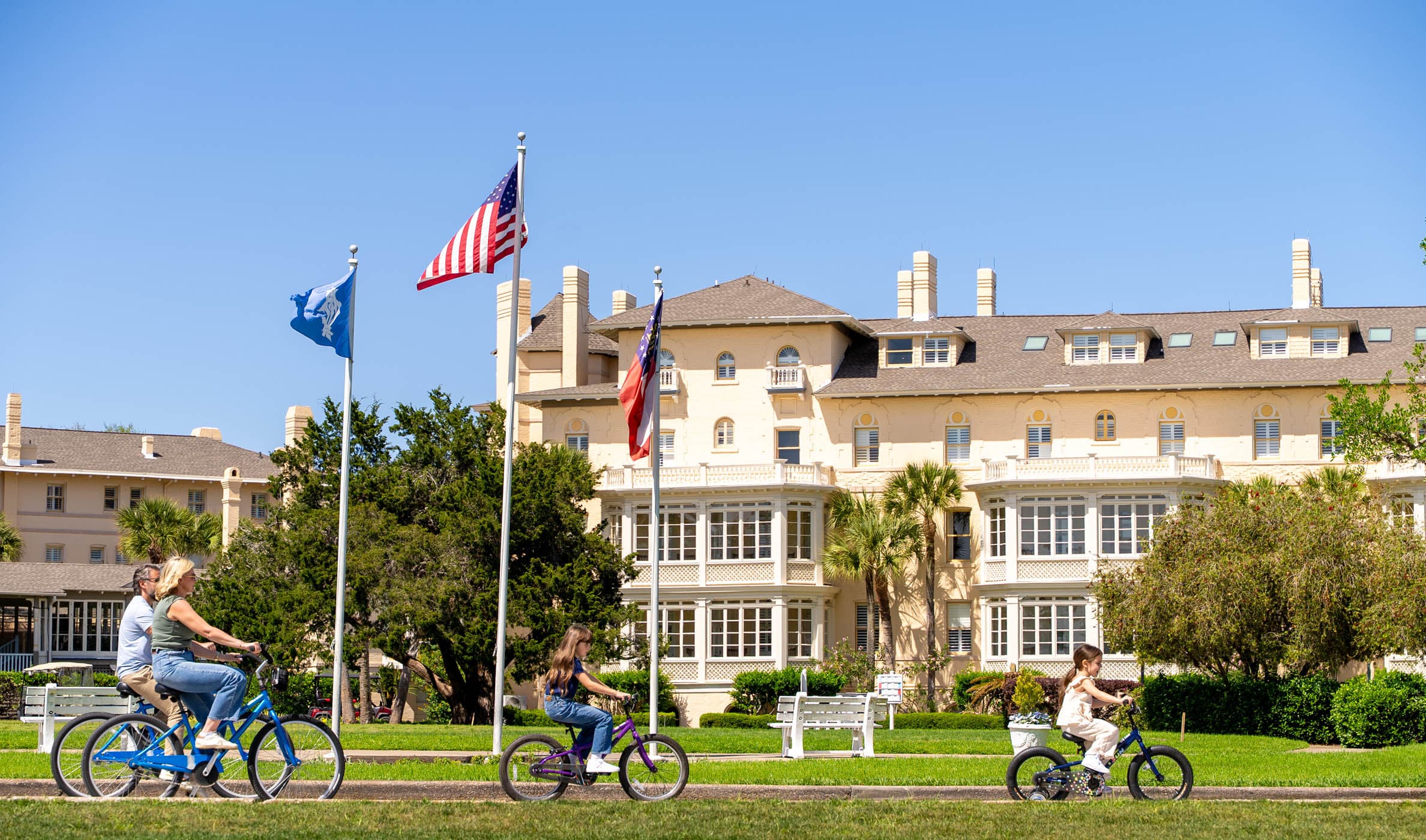 A family biking on a path near JICR