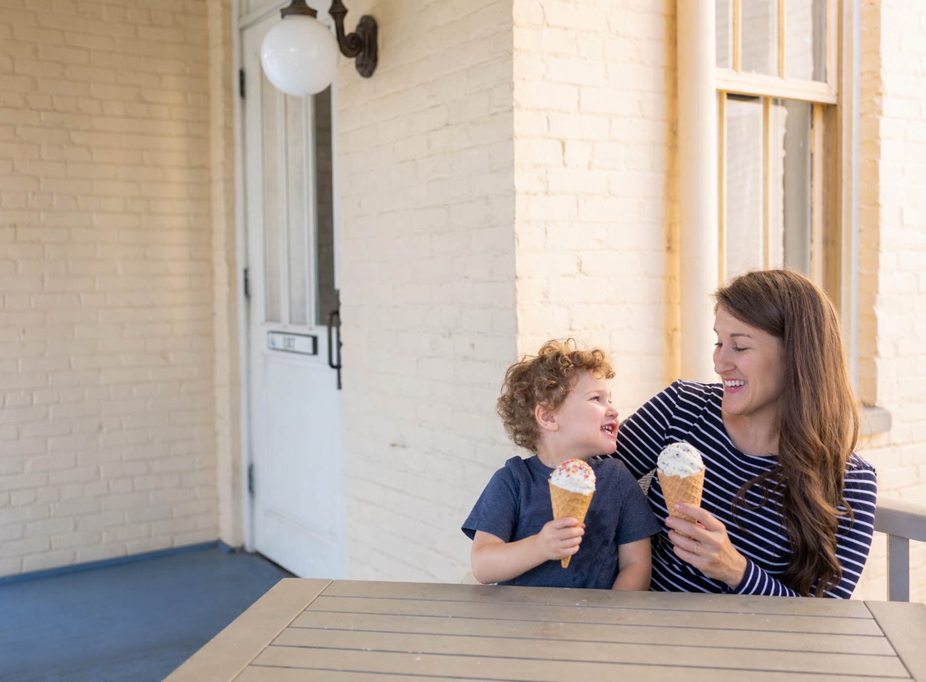 A mother and son enjoying ice cream cones