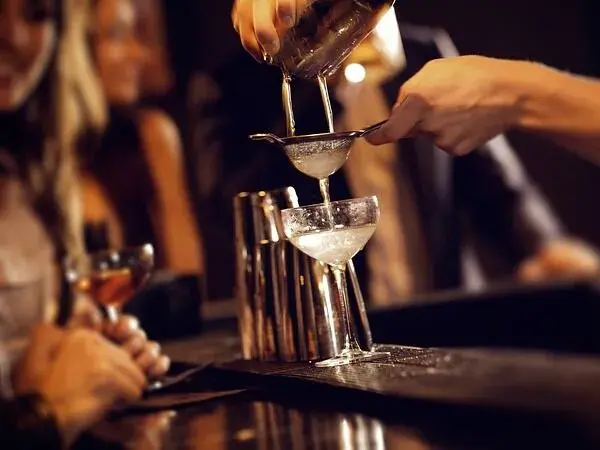 A bartender making a Craft Cocktail
