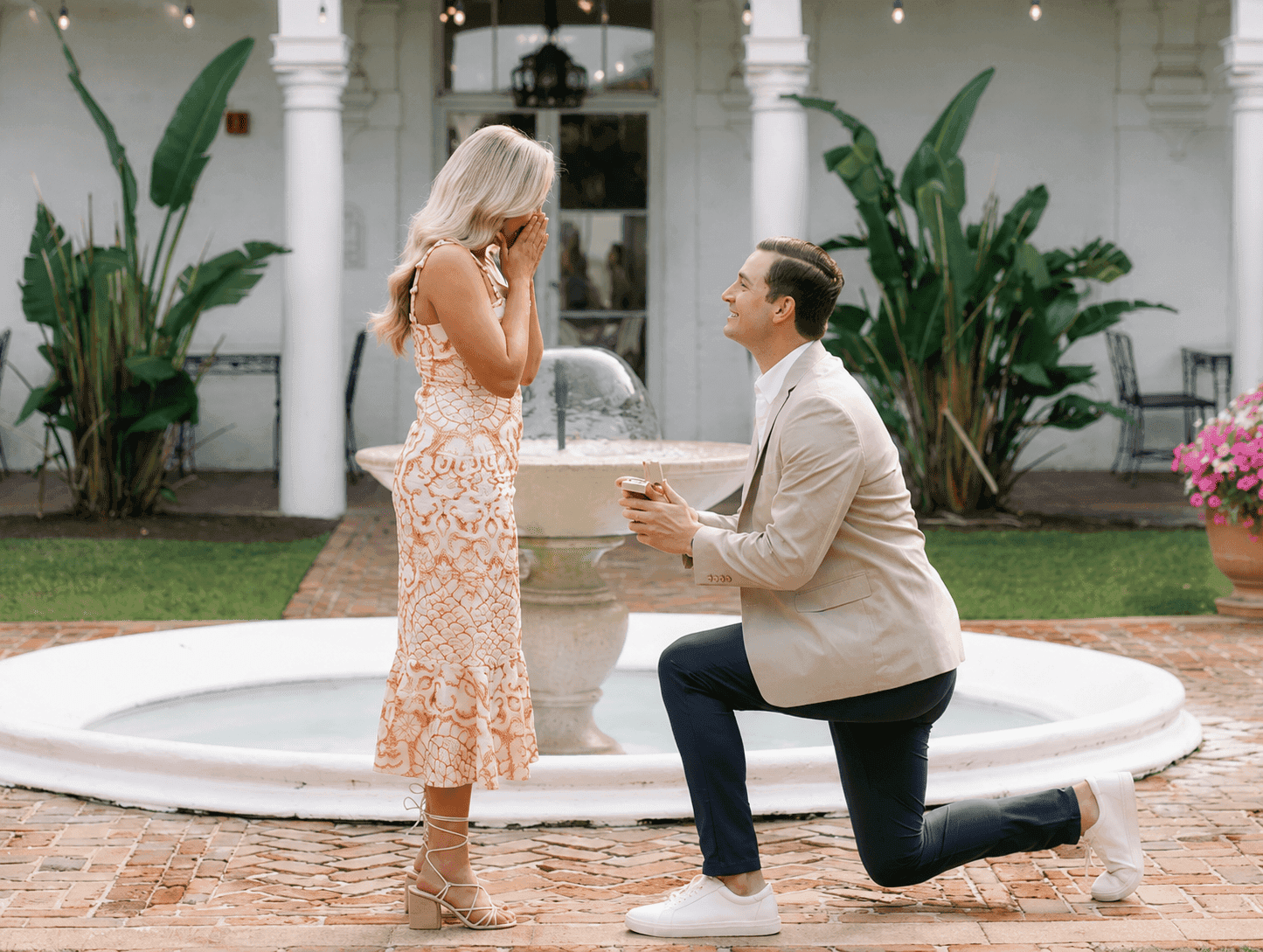 A man on one knee proposing at Crane Cottage
