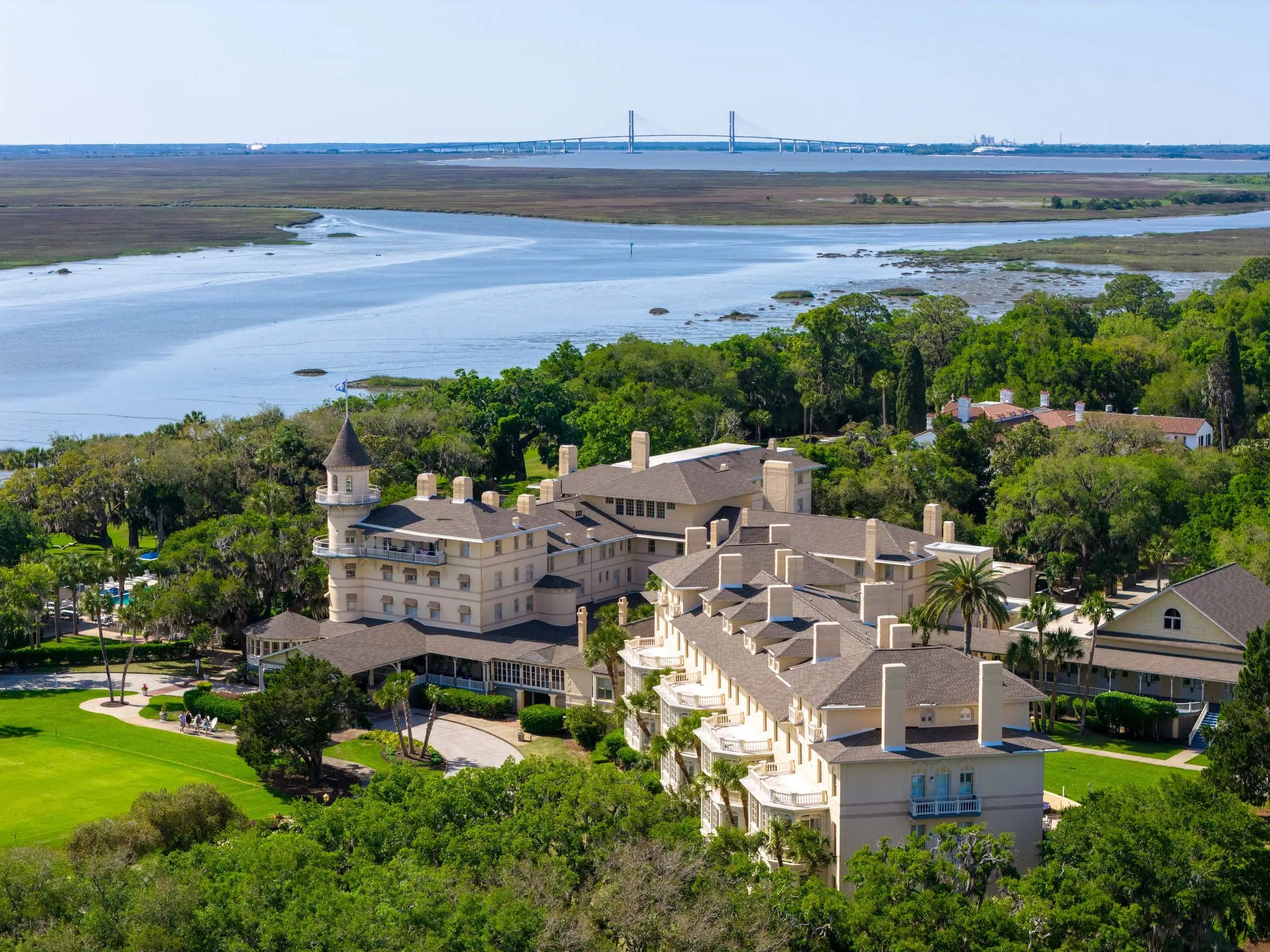 Exterior of JIC with a large bridge in the background and a large body of water