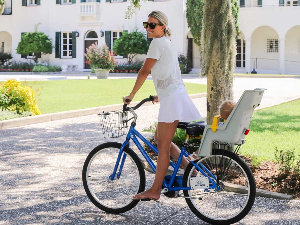 Lady With An Infant On A Bike.