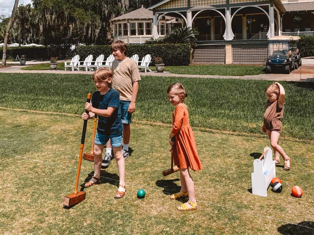 Kids Playing Croquet.