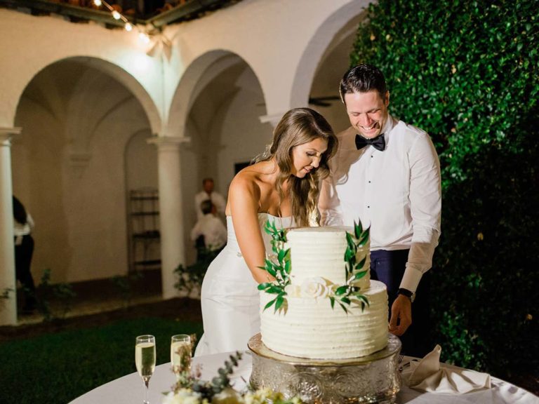Carolyne And Davis Cutting The Cake.