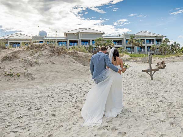 Bride And Groom On The Beach.