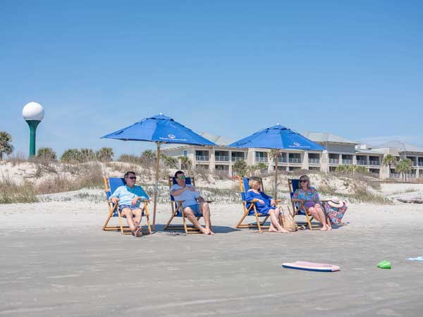 People Lounging On The Beach.