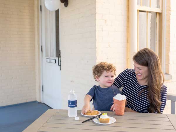 Mom And Son Having Pastries And Smoothies.