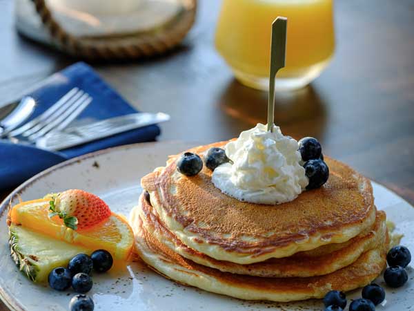 Pancakes With Fruit And Whipped Cream.