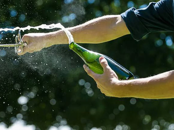 Guy Opening Champagne.