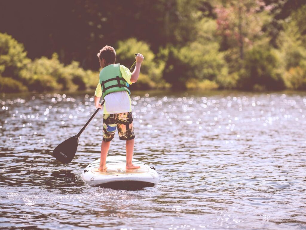 Kid On A Stand Up Paddleboard
